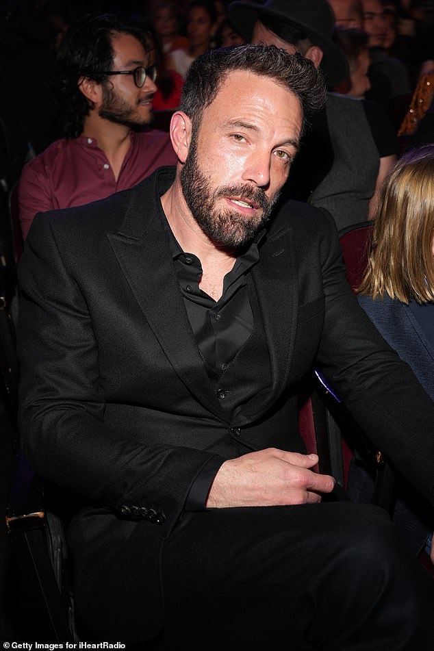 Ben's look: Affleck stepped out in a black on black look, wearing a slightly untidy shirt under a black suit coat