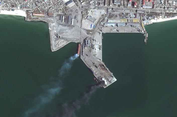 Satellite images show a Russian amphibious warship in flames in the port of Berdyansk (bottom) after being struck by Ukrainian forces in Match 24.