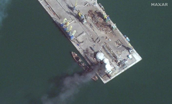 Satellite images show a Russian amphibious warship in flames in the port of Berdyansk after being hit by Ukrainian forces in Match 24.