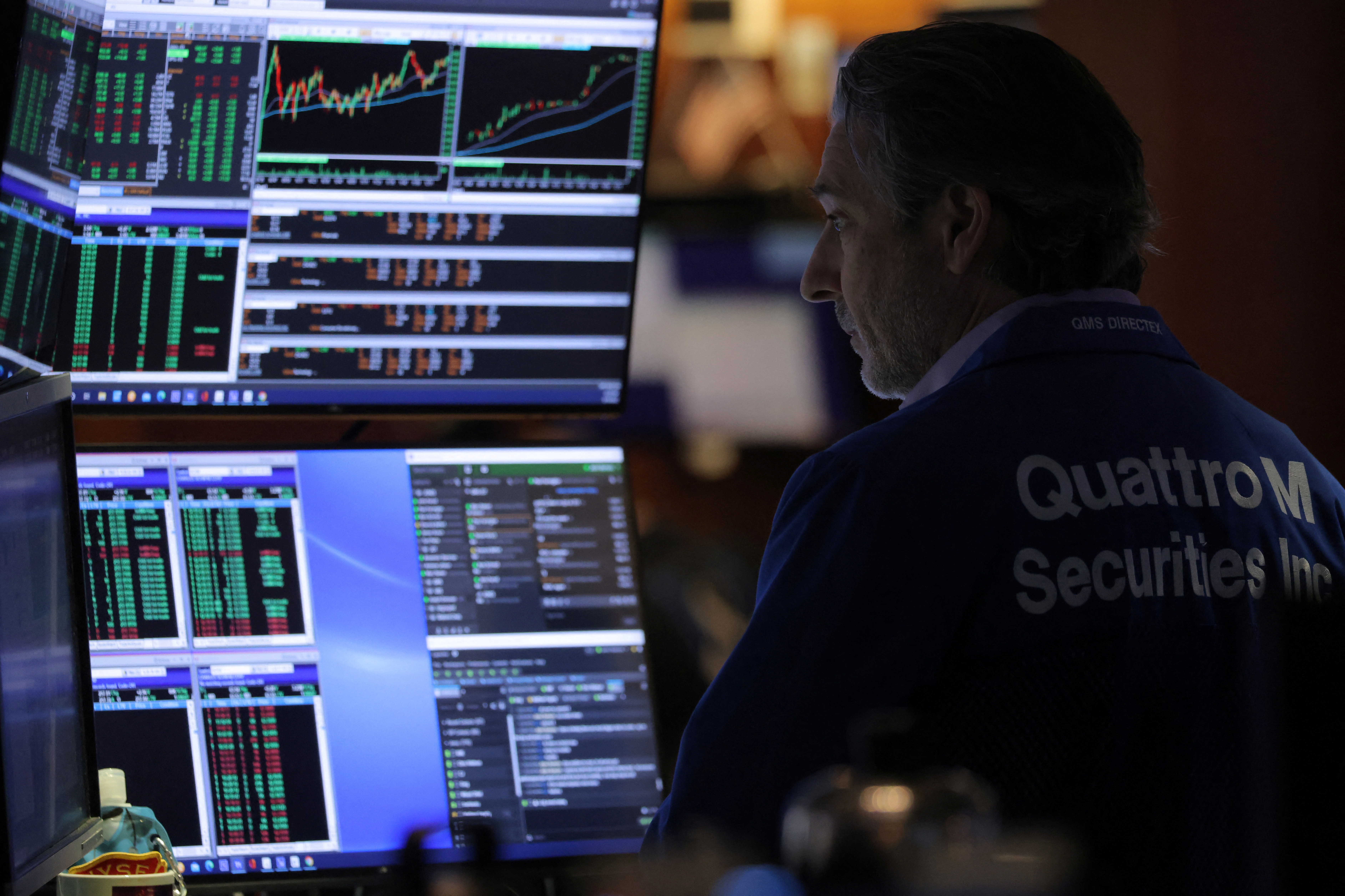 A trader works on the trading floor of the New York Stock Exchange (NYSE) in Manhattan, New York City