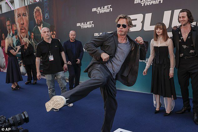 Acting: Brad Pitt, 58, gave a racy show kicking his leg in the air at the Paris premiere of his Bullet Train on Monday