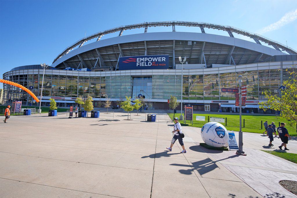 A woman has died after falling from an escalator after a Kenny Chesney concert at Empower Field at Mile High in Denver, Colorado.