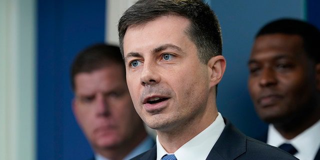 FILE - Secretary of Transportation Pete Buttigieg, center, speaks during a briefing at the White House in Washington, May 16, 2022.