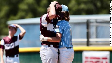 Oklahoma player Isaiah Jarvis, right, comforts East Texas player Kayden Shelton during the Little League Southwest District on Tuesday after being injured at Kayden Stadium.