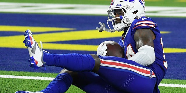 Wide receiver Stefon Diggs #14 of the Buffalo Bills picks up a 53-yard touchdown reception against the Los Angeles Rams during the fourth quarter of an NFL game at SoFi Stadium on September 08, 2022 in Inglewood, California.