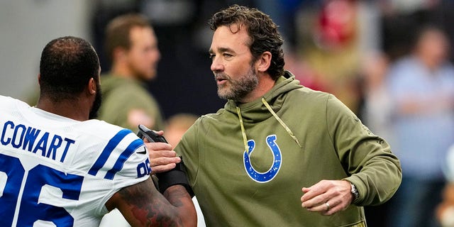 Indianapolis Colts interim head coach Jeff Saturday welcomes defensive tackle Byron Cowart before the NFL's football game against the Las Vegas Raiders in Las Vegas, Sunday, November 13, 2022. 