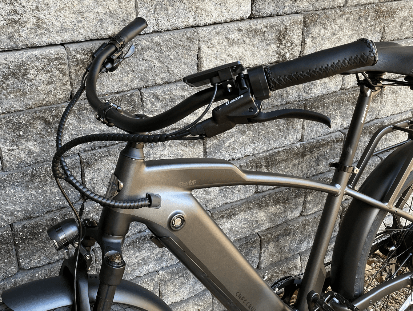 The grips filled with faux leather grips and front suspension are an odd combination. 